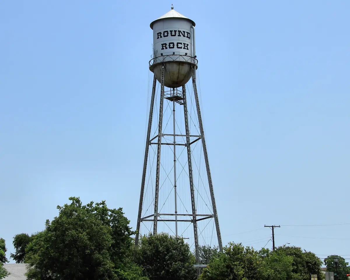 The old Round Rock water tower with Round Rock painted on the tank